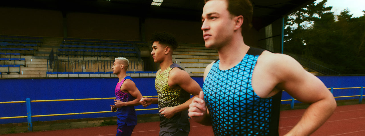 Three runners jogging side by side